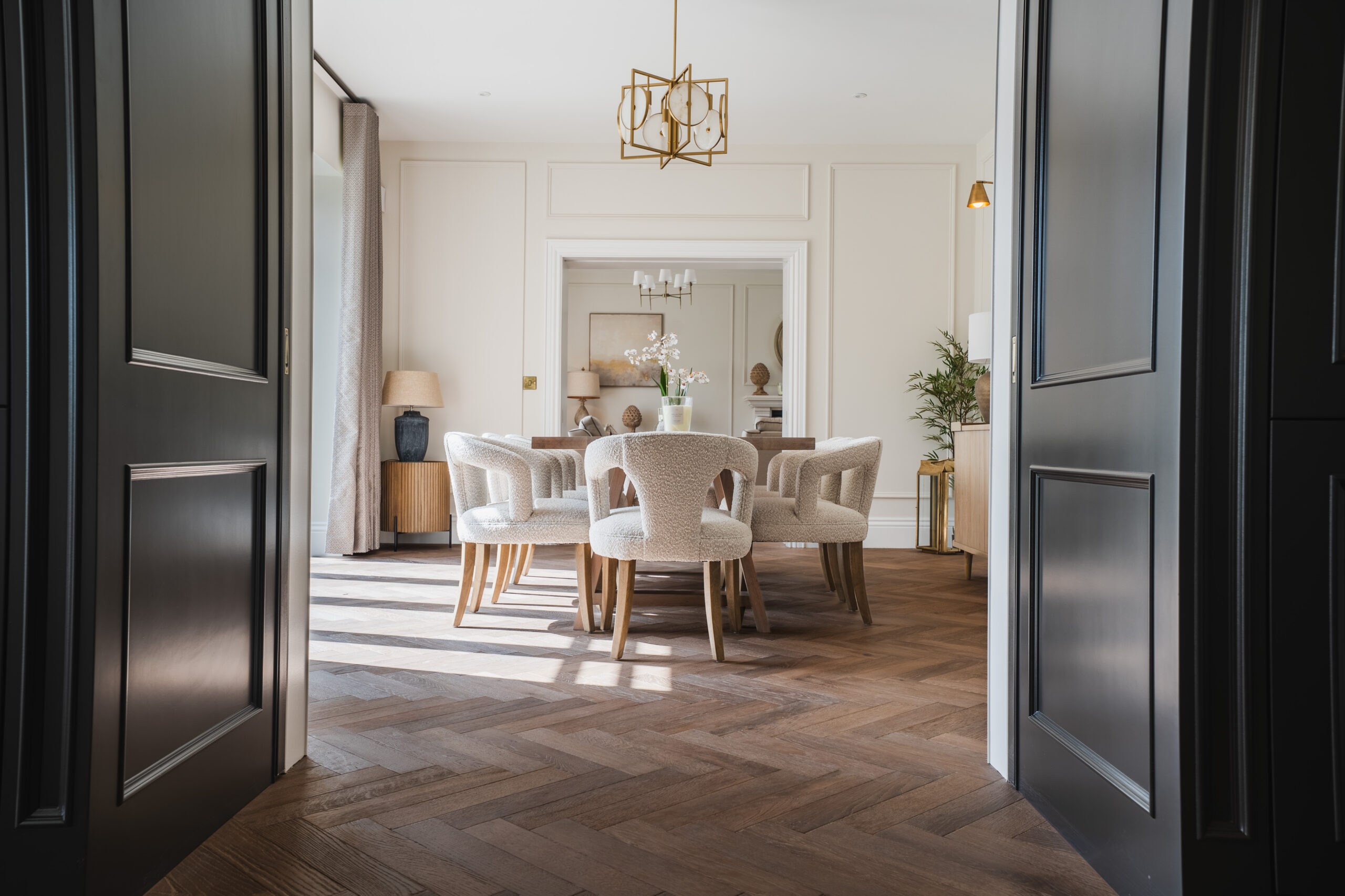 Herringbone flooring in an elegant dining room