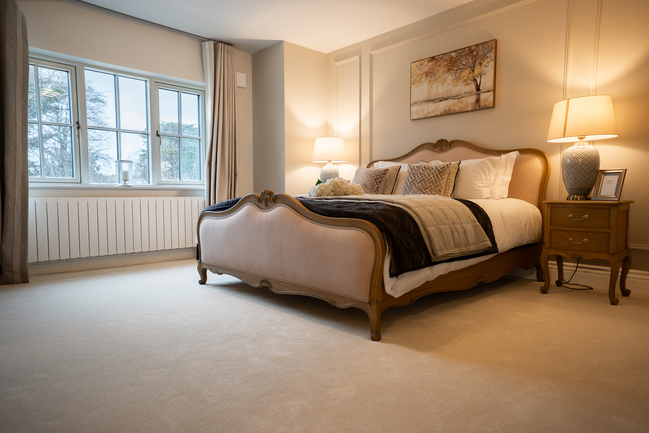 Soft neutral carpet across a light-filled bedroom